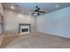 Spacious living room featuring a fireplace, ceiling fan, neutral paint, carpeted floors, and recessed lighting at 3684 Mooncrest Cir, Las Vegas, NV 89129
