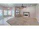Bright living room features fireplace, large windows, and space for entertaining guests at 3684 Mooncrest Cir, Las Vegas, NV 89129