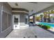 Enjoy outdoor living on the covered patio with views of the refreshing pool and lush landscaping at 3684 Mooncrest Cir, Las Vegas, NV 89129