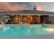 Backyard pool featuring a sparkling pool, covered patio, and well-maintained landscaping at 3684 Mooncrest Cir, Las Vegas, NV 89129