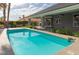 Enjoy a sparkling swimming pool with built-in steps and an expansive backyard at 3684 Mooncrest Cir, Las Vegas, NV 89129