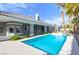 Enjoy a luxurious pool experience with access to a covered patio in this private and serene backyard at 3684 Mooncrest Cir, Las Vegas, NV 89129