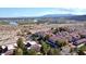 Community aerial view featuring red tile roofs, lush landscaping, a lake, and distant mountains at 3740 Desert Marina Dr # 12, Laughlin, NV 89029