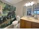 Nice bathroom with a beautiful shower curtain and plenty of storage at 3740 Desert Marina Dr # 12, Laughlin, NV 89029