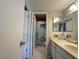 Bathroom featuring a neutral colored vanity and a shower with sea life curtain at 3740 Desert Marina Dr # 12, Laughlin, NV 89029