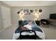 Charming bedroom featuring a guitar-themed bedspread, desk, and eclectic wall decor at 3740 Desert Marina Dr # 12, Laughlin, NV 89029