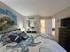 Bedroom featuring a queen bed with turtle themed bedding and TV at 3740 Desert Marina Dr # 12, Laughlin, NV 89029
