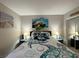 Bedroom featuring a queen bed with turtle themed bedding and mirrored closet at 3740 Desert Marina Dr # 12, Laughlin, NV 89029