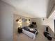Loft bedroom with guitar decorations, TV, and minimalist decor at 3740 Desert Marina Dr # 12, Laughlin, NV 89029