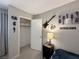 Comfortable bedroom offers a walk-in closet, guitar wall art, and modern bedside lighting at 3740 Desert Marina Dr # 12, Laughlin, NV 89029
