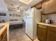 Bright dining space includes a table with bench seating and view of the refrigerator at 3740 Desert Marina Dr # 12, Laughlin, NV 89029