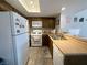 Practical kitchen with tiled floors, a double-bowl sink, and essential appliances at 3740 Desert Marina Dr # 12, Laughlin, NV 89029