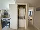A compact laundry closet with a stacked washer and dryer unit in a condo at 3740 Desert Marina Dr # 12, Laughlin, NV 89029