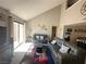 Comfortable living room with vaulted ceiling, a slider leading to a patio, and tasteful furnishings at 3740 Desert Marina Dr # 12, Laughlin, NV 89029