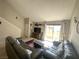 Inviting living room with sliding glass door to patio, a ceiling fan, and comfortable couches at 3740 Desert Marina Dr # 12, Laughlin, NV 89029