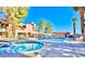 Inviting community pool area with a spa, lounge chairs, and well-maintained landscaping at 3740 Desert Marina Dr # 12, Laughlin, NV 89029