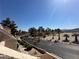 Neighborhood street view showcasing the mature trees, green landscaping, and desert setting at 3740 Desert Marina Dr # 12, Laughlin, NV 89029