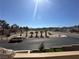 Scenic view from the home's balcony showing a sunny street with desert landscaping and mountain views at 3740 Desert Marina Dr # 12, Laughlin, NV 89029