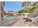 Backyard oasis with a pool, fire pit, and ample seating at 3886 Green Leaf Dr, Las Vegas, NV 89120
