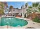 Enjoy the backyard pool with hot tub, covered patio, and seating area at 3886 Green Leaf Dr, Las Vegas, NV 89120