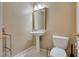 Half bathroom with a pedestal sink, tile flooring, and standard toilet at 3886 Green Leaf Dr, Las Vegas, NV 89120