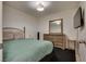 Well-lit bedroom with a bed, dresser, and mounted TV, providing a comfortable and modern living space at 3886 Green Leaf Dr, Las Vegas, NV 89120