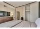 Comfortable bedroom features a closet with sliding doors, a dresser with TV, and a cozy bed at 3886 Green Leaf Dr, Las Vegas, NV 89120