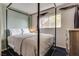 Charming bedroom with a four-poster bed next to a window and a dresser that offers a cozy and inviting atmosphere at 3886 Green Leaf Dr, Las Vegas, NV 89120