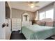 Comfortable bedroom with a ceiling fan, dresser, and bright window at 3886 Green Leaf Dr, Las Vegas, NV 89120