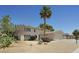 Two-story home featuring desert landscaping, a palm tree, attached garage, and driveway at 3886 Green Leaf Dr, Las Vegas, NV 89120
