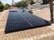A view of the solar panels affixed to the roof of the home, showing the neighborhood behind the house at 3886 Green Leaf Dr, Las Vegas, NV 89120