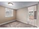 Cozy bedroom with neutral paint, carpet flooring, and natural light at 3905 Cherokee Ave, Las Vegas, NV 89121