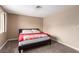 Bedroom features neutral-toned carpet, a bed, and a large window for natural light at 3905 Cherokee Ave, Las Vegas, NV 89121