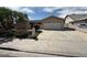 Traditional home featuring a two-car garage, well-kept lawn, and mature landscaping at 3905 Cherokee Ave, Las Vegas, NV 89121