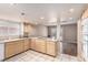 Kitchen area featuring tile floor, natural wood cabinets, and a smooth cooktop at 3905 Cherokee Ave, Las Vegas, NV 89121
