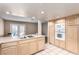 Bright kitchen with stainless steel appliances, a cooktop and an oven, and access to the living room at 3905 Cherokee Ave, Las Vegas, NV 89121