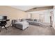 Comfortable living room featuring neutral walls, carpet flooring, and ample seating at 3905 Cherokee Ave, Las Vegas, NV 89121