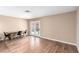 Bright living room featuring hardwood floors and glass doors leading to outdoor space at 3905 Cherokee Ave, Las Vegas, NV 89121