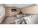 Cozy living room with neutral paint, carpet flooring, and comfortable seating at 3905 Cherokee Ave, Las Vegas, NV 89121