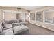 Comfortable living room featuring neutral walls, carpet flooring, and ample seating at 3905 Cherokee Ave, Las Vegas, NV 89121