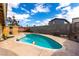 Bright, sunny pool is fenced and features a playful beach ball float at 3905 Cherokee Ave, Las Vegas, NV 89121
