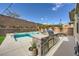 Backyard featuring a refreshing pool and a built-in outdoor kitchen, great for entertaining guests at 421 Malpaso St, Las Vegas, NV 89138