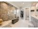 Stunning bathroom with tiled shower, walk-in closet, and double vanity sinks at 421 Malpaso St, Las Vegas, NV 89138