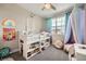 Charming bedroom with whimsical décor, colorful accents, and comfortable layout at 421 Malpaso St, Las Vegas, NV 89138