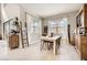 Inviting dining area featuring natural light, a dining table, and stylish decor at 421 Malpaso St, Las Vegas, NV 89138