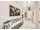 Bright and inviting entryway featuring a bench, decorative map, and high ceilings at 421 Malpaso St, Las Vegas, NV 89138