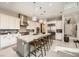 Modern kitchen featuring a large center island, stainless steel appliances, white cabinets, and pendant lighting at 421 Malpaso St, Las Vegas, NV 89138