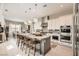 Well-equipped kitchen features a center island, stainless steel appliances, and a dining area in the background at 421 Malpaso St, Las Vegas, NV 89138