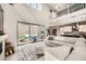 Bright living area with a view of the pool and backyard, featuring a comfortable sectional sofa at 421 Malpaso St, Las Vegas, NV 89138