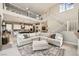 Spacious living area with a large sectional sofa, high ceilings, and seamless flow to the kitchen at 421 Malpaso St, Las Vegas, NV 89138